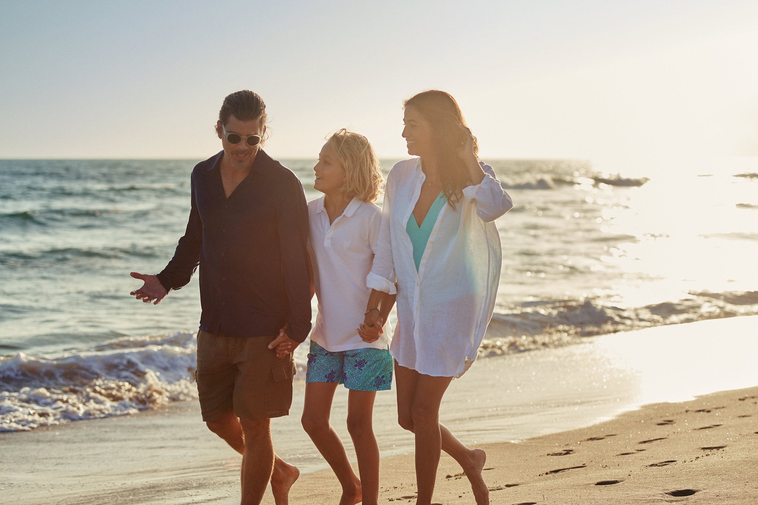 family walking on the beach